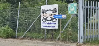 AutoMTG Kfz-Meisterwerkstatt Schild an der Einfahrt Rögen 18